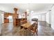 Open layout combining the kitchen and living areas, featuring a breakfast bar, wooden table, and comfortable sofa at 1981 Line Rd, Lancaster, SC 29720