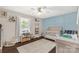Charming Bedroom with a crib and natural light at 1990 Country Club Dr, Lancaster, SC 29720