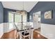 Cozy dining room with stylish lighting, a rustic table, and large windows for natural light at 1990 Country Club Dr, Lancaster, SC 29720