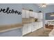 Functional kitchen with white cabinets, tile backsplash, and a convenient layout at 1990 Country Club Dr, Lancaster, SC 29720