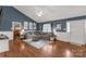 Cozy living room featuring hardwood floors, stylish decor, and a comfortable seating area at 1990 Country Club Dr, Lancaster, SC 29720