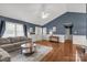 Bright living room with hardwood floors, high ceiling, and modern furnishings, creating a welcoming atmosphere at 1990 Country Club Dr, Lancaster, SC 29720