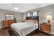 Cozy bedroom featuring wood-look flooring, a ceiling fan, and a spacious layout at 1990 Country Club Dr, Lancaster, SC 29720