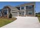 Charming two-story home featuring a stone and gray siding exterior with a wide driveway at 2084 Fordhill St, Rock Hill, SC 29732