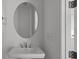 This bathroom features a modern sink with an oval mirror at 210 Goldenrod Cir, Salisbury, NC 28147