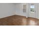 Bedroom with hardwood floors and a view of the front yard at 210 Goldenrod Cir, Salisbury, NC 28147