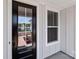 A close-up view of the front door with a black frame and a window allowing light into the house at 210 Goldenrod Cir, Salisbury, NC 28147