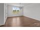 Bright living room with natural light from a large window and hardwood floors at 210 Goldenrod Cir, Salisbury, NC 28147