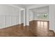 Living room featuring hardwood floors, white walls, and a large window that offers a view of the outdoors at 210 Goldenrod Cir, Salisbury, NC 28147