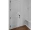 Bright mudroom features a white door, hardwood floors, bench, and coat hooks at 210 Goldenrod Cir, Salisbury, NC 28147