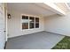 Covered patio with concrete flooring and multiple windows providing natural light and outdoor views at 210 Goldenrod Cir, Salisbury, NC 28147