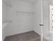 Walk-in closet with carpet floors, wire shelving and a door to another room at 210 Goldenrod Cir, Salisbury, NC 28147