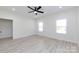 This bright bedroom features a ceiling fan and a pair of windows, offering plenty of natural light at 240 Doster Rd, Lancaster, SC 29720