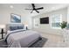 This bedroom features a ceiling fan, carpet, and bright, natural light at 240 Doster Rd, Lancaster, SC 29720