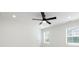 This bedroom boasts a ceiling fan, bright, natural light, and neutral carpet at 240 Doster Rd, Lancaster, SC 29720