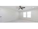 This bedroom boasts a ceiling fan, bright, natural light, and neutral carpet at 240 Doster Rd, Lancaster, SC 29720