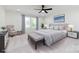 This bedroom features a ceiling fan, carpet, and bright, natural light at 240 Doster Rd, Lancaster, SC 29720