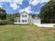 Stunning two-story home with white siding, black shutters, and a lush green lawn at 240 Doster Rd, Lancaster, SC 29720