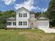 Charming two-story home with white siding, black shutters, and a well-manicured lawn at 240 Doster Rd, Lancaster, SC 29720
