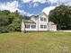 Beautiful two-story house with white siding, black shutters, and green lawn at 240 Doster Rd, Lancaster, SC 29720