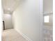 Hallway leads to a well-lit bedroom with a window, showcasing the home's bright interior at 240 Doster Rd, Lancaster, SC 29720