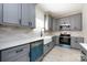 Stylish kitchen featuring gray cabinets, modern appliances, and a bright, airy atmosphere at 240 Doster Rd, Lancaster, SC 29720