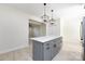 Bright kitchen with a large island, pendant lighting, and access to the living room at 240 Doster Rd, Lancaster, SC 29720