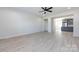 Open-concept living room that opens to a kitchen with hardwood floors and white walls at 240 Doster Rd, Lancaster, SC 29720