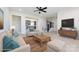 Staged living room that opens to a kitchen with hardwood floors and modern furniture and fixtures at 240 Doster Rd, Lancaster, SC 29720