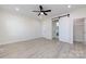 This bright main bedroom boasts a ceiling fan, and a sliding door to the walk-in closet and ensuite at 240 Doster Rd, Lancaster, SC 29720