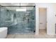 This stunning glass shower boasts elegant tile surround and modern black fixtures at 240 Doster Rd, Lancaster, SC 29720