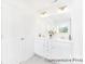 Bright bathroom with double sinks, white cabinets, and a large mirror at 2416 Morgan Hills Dr # 297P, Albemarle, NC 28001