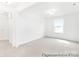 Spacious bedroom with neutral carpet, large window, and ample natural light at 2416 Morgan Hills Dr # 297P, Albemarle, NC 28001