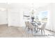 Bright dining room with natural light, elegant chandelier, modern table set, and decorative rug adding sophistication at 2416 Morgan Hills Dr # 297P, Albemarle, NC 28001
