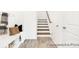 Charming entryway with coat hooks, bench seating, and stairs leading to the upper level at 2416 Morgan Hills Dr # 297P, Albemarle, NC 28001
