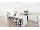 Bright kitchen featuring a large center island with seating, modern appliances, white cabinets, and hardwood floors at 2416 Morgan Hills Dr # 297P, Albemarle, NC 28001