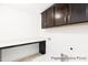 Practical laundry room with counter space, dark cabinets, and appliances hook-ups at 2416 Morgan Hills Dr # 297P, Albemarle, NC 28001