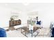 Open-concept living room featuring hardwood floors, neutral furniture, and views into the kitchen and dining areas at 2416 Morgan Hills Dr # 297P, Albemarle, NC 28001