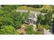 A beautiful home with a deck and a well-maintained lawn is surrounded by lush green trees at 2501 Mt Isle Harbor Dr, Charlotte, NC 28214