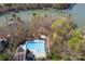 Overhead view of a neighborhood pool, a dock, and some boathouses located on the water at 2501 Mt Isle Harbor Dr, Charlotte, NC 28214