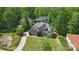 A charming two-story home with a big manicured lawn, a long driveway, and mature trees at 2501 Mt Isle Harbor Dr, Charlotte, NC 28214