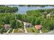Aerial view of the property showcasing the home's location amongst mature trees and lake access at 2501 Mt Isle Harbor Dr, Charlotte, NC 28214