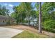 Expansive backyard with lush greenery, lake views, and ample space for outdoor activities, offering serene living at 2501 Mt Isle Harbor Dr, Charlotte, NC 28214
