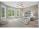 Spacious bedroom with large windows overlooking lush greenery, inviting natural light and scenic views at 2501 Mt Isle Harbor Dr, Charlotte, NC 28214