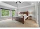 Tranquil bedroom with tray ceilings, neutral tones, and plenty of natural light at 2501 Mt Isle Harbor Dr, Charlotte, NC 28214