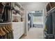 Walk-in closet with custom shelving and ample storage space at 2501 Mt Isle Harbor Dr, Charlotte, NC 28214