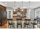 Modern kitchen boasts granite countertops, stainless appliances, and bar seating at 2501 Mt Isle Harbor Dr, Charlotte, NC 28214