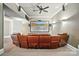Home theater room equipped with comfortable seating, surround sound and a large flat screen for an immersive experience at 2501 Mt Isle Harbor Dr, Charlotte, NC 28214