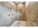 Tiled shower with rain shower head and built-in niche at 2501 Mt Isle Harbor Dr, Charlotte, NC 28214