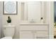 Bathroom featuring a vanity with white cabinets, stylish fixtures, and a decorative mirror at 2806 Morning Song Way, Lancaster, SC 29720